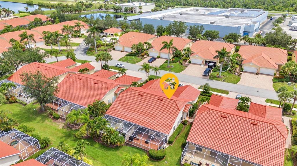 3715 Albacete Circle, Unit 93 Punta Gorda, FL 33950 - Photo 31 of 32 an aerial view of a house with a swimming pool yard and outdoor seating
