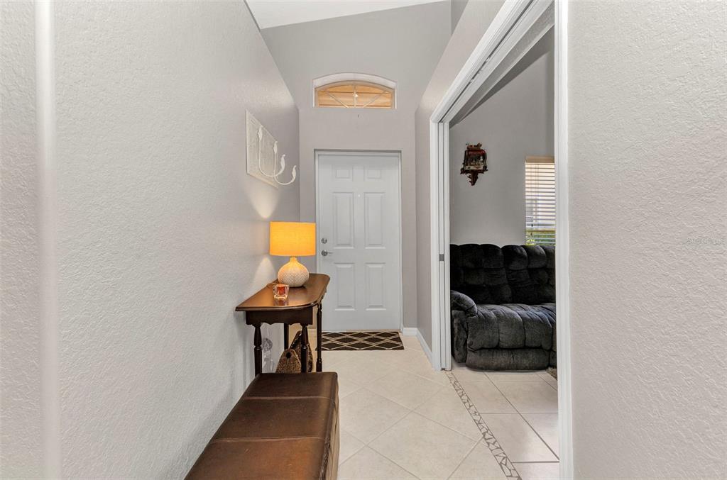 3715 Albacete Circle, Unit 93 Punta Gorda, FL 33950 - Photo 4 of 32 a view of a hallway with chairs and couches in a room