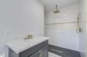 a bathroom with a sink and vanity