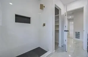 a view of a bathroom with shower