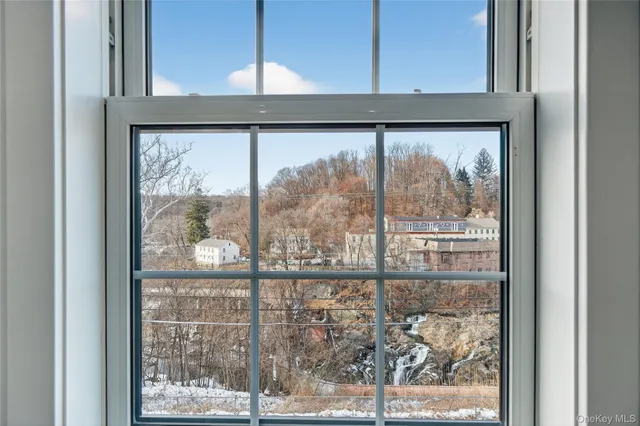 a view of a room that has a window in it