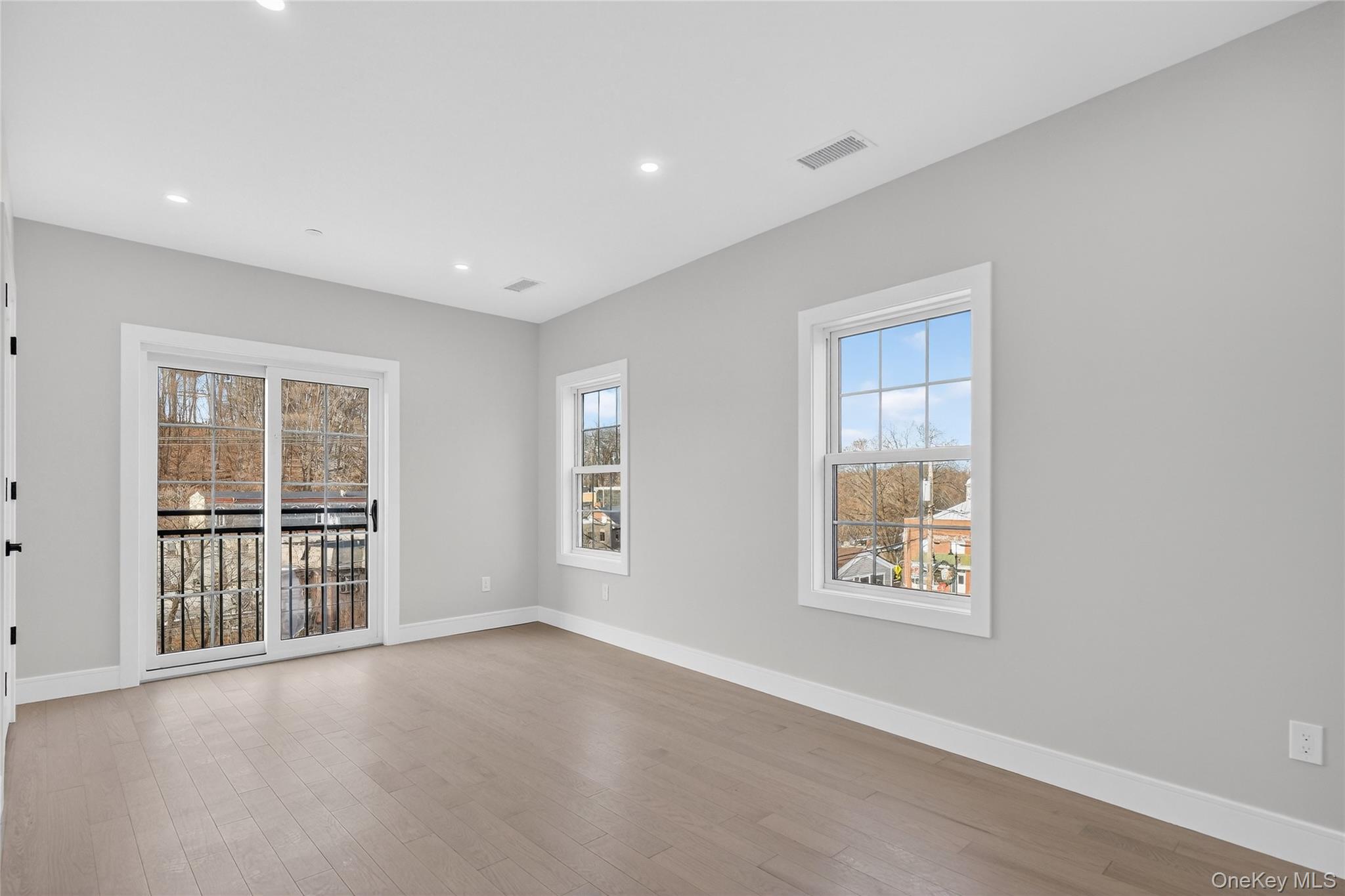 10 Market Street, Unit H Wappingers Falls, NY 12590 - Photo 16 of 24 an empty room with windows
