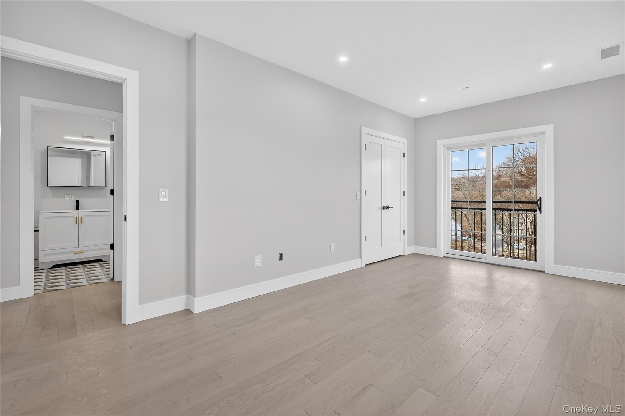 10 Market Street, Unit H Wappingers Falls, NY 12590 - Photo 18 of 24 wooden floor in an empty room with a window