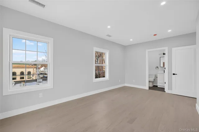 a view of empty room with windows