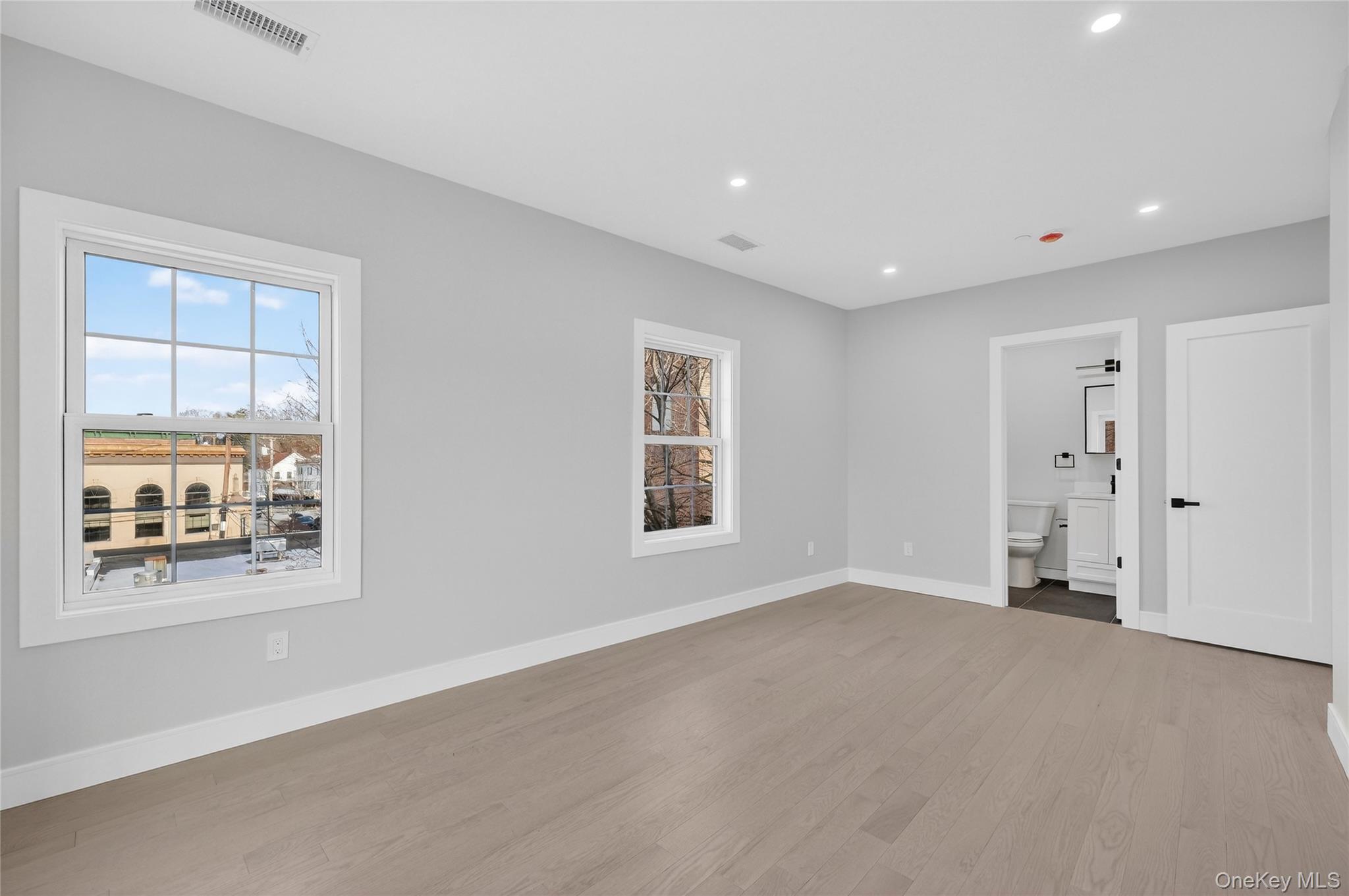 10 Market Street, Unit H Wappingers Falls, NY 12590 - Photo 19 of 24 a view of empty room with windows