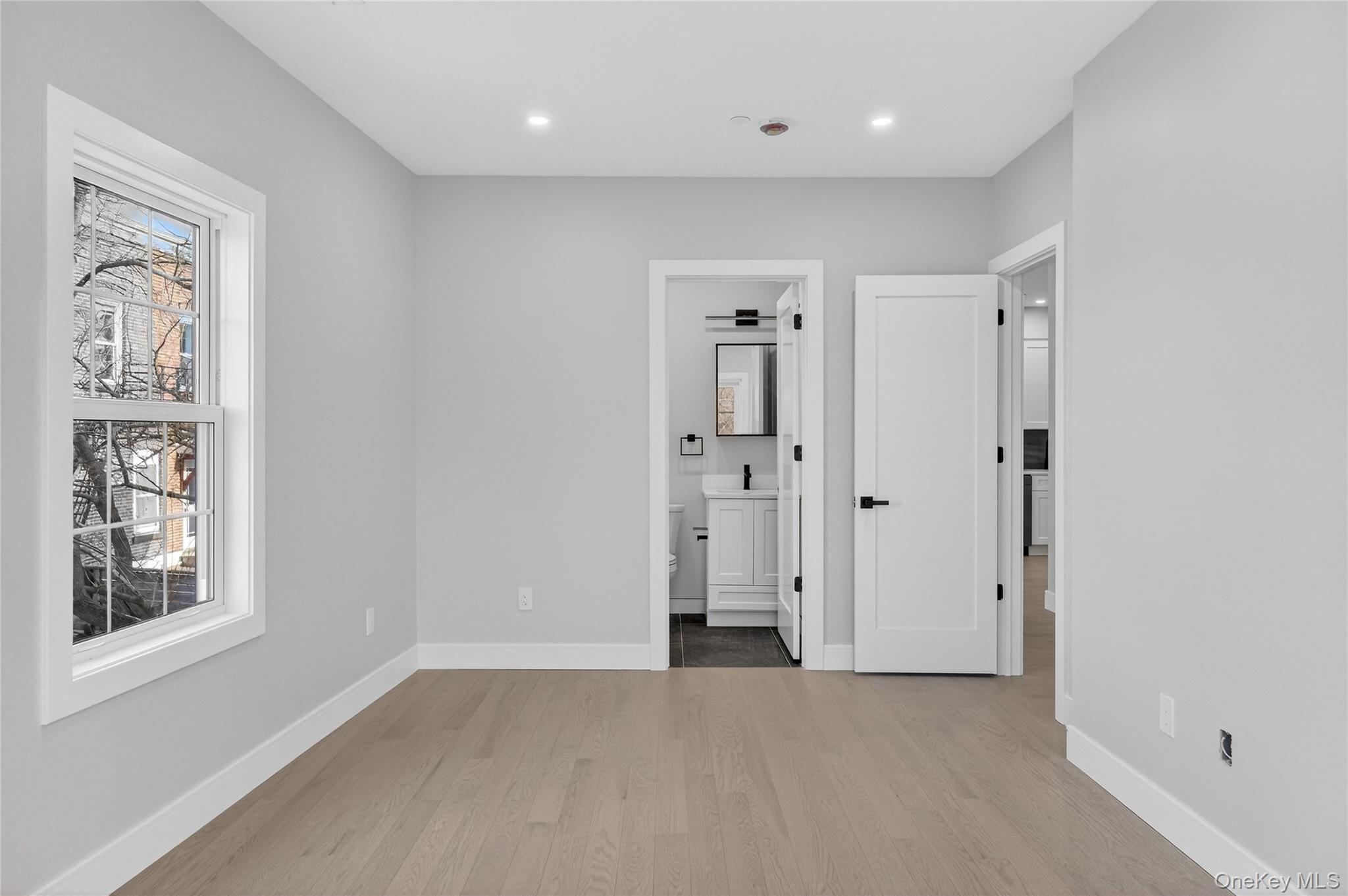 10 Market Street, Unit H Wappingers Falls, NY 12590 - Photo 20 of 24 an empty room with windows and closet