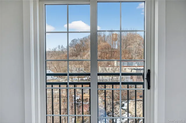 a view of a room with a large window