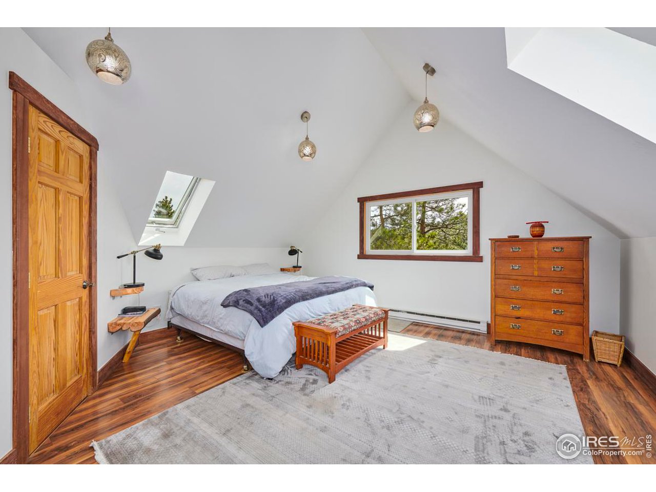347 Kelly Road East Boulder, CO 80302 - Photo 12 of 30 a bedroom with a bed and a dresser