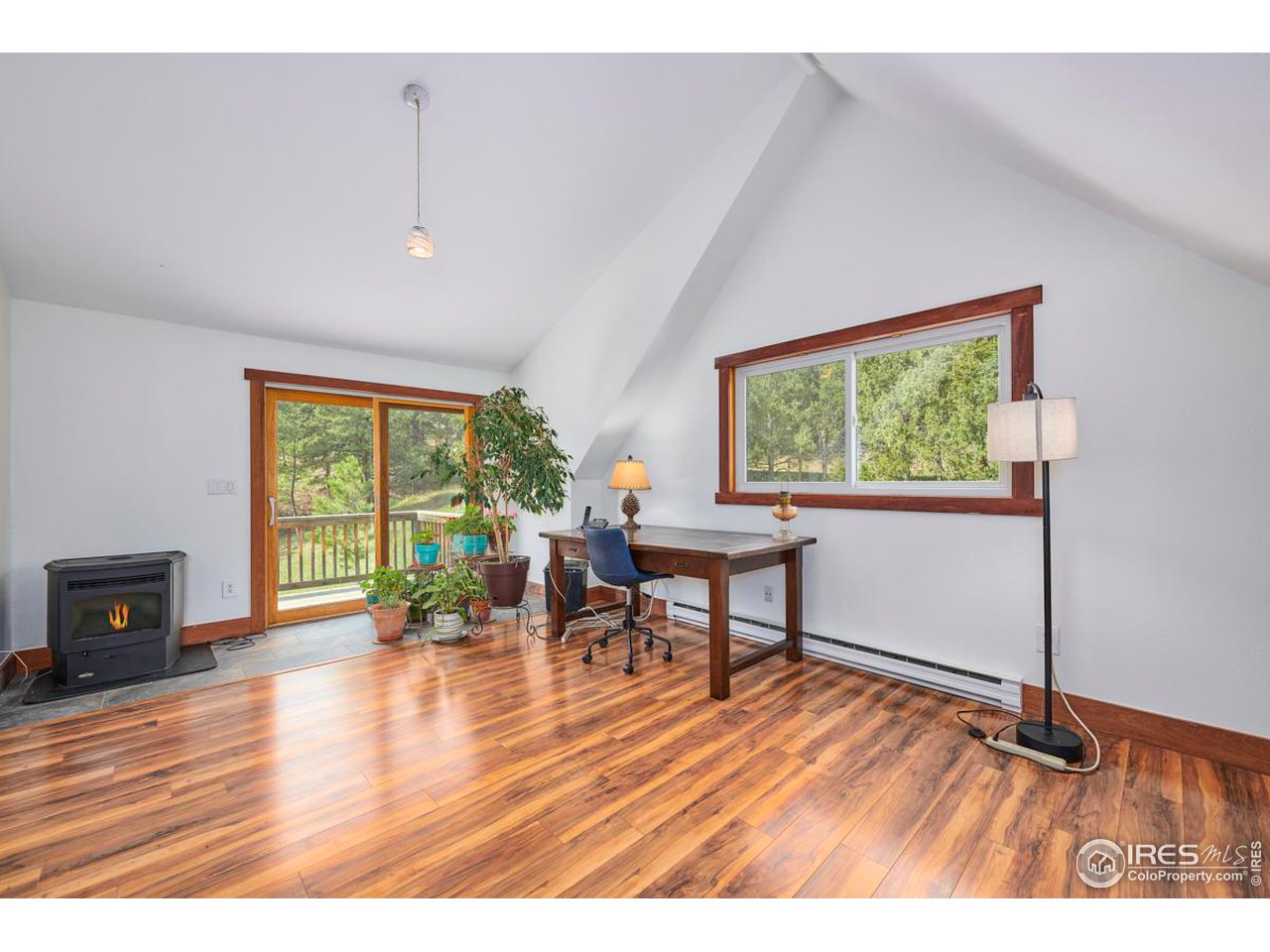 347 Kelly Road East Boulder, CO 80302 - Photo 13 of 30 a view of a livingroom with furniture window and wooden floor