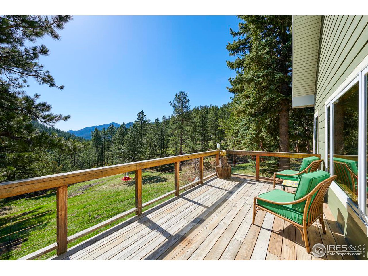 347 Kelly Road East Boulder, CO 80302 - Photo 21 of 30 a view of balcony with wooden floor and outdoor seating
