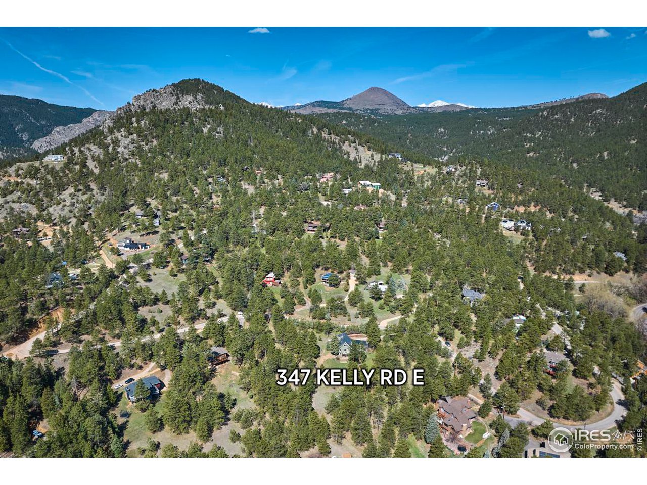 347 Kelly Road East Boulder, CO 80302 - Photo 26 of 30 a view of a city with mountains in the background