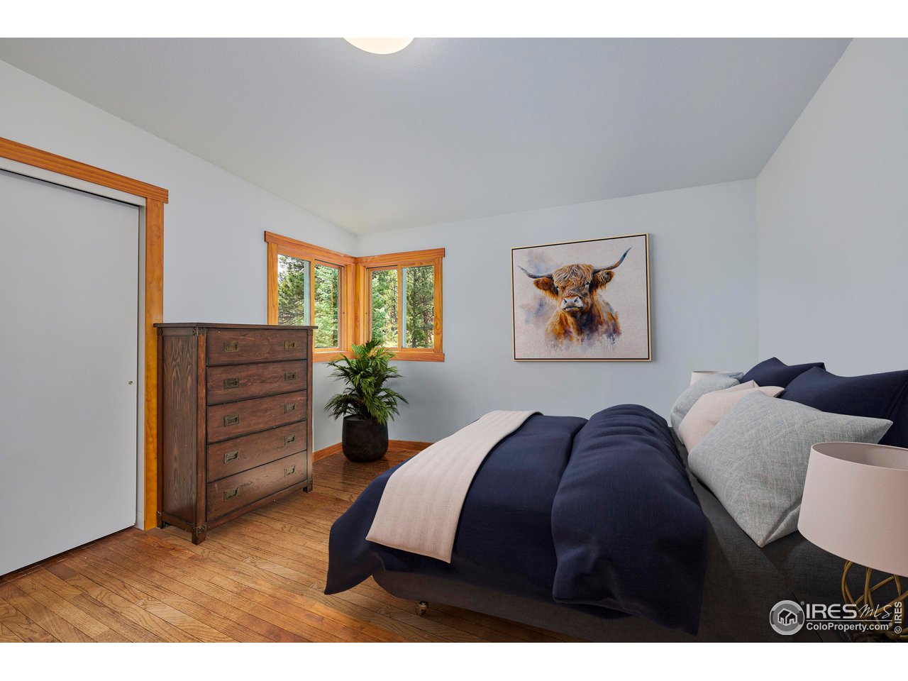 347 Kelly Road East Boulder, CO 80302 - Photo 9 of 30 a bedroom with a bed dresser and a window