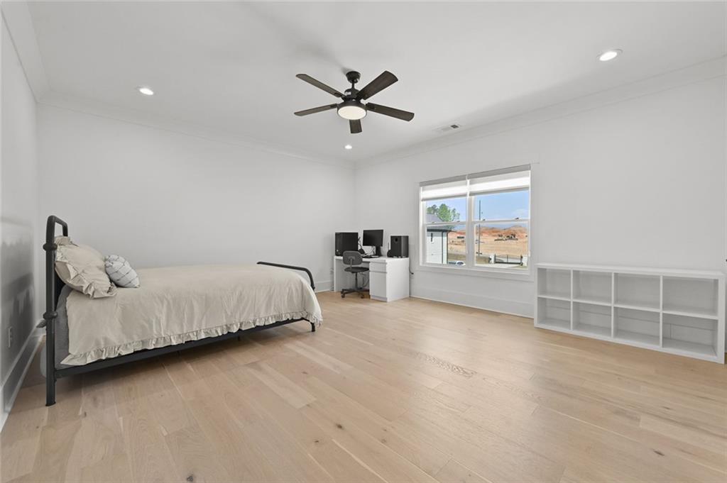 2694 Thompson Mill Road Buford, GA 30519 - Photo 47 of 70 a spacious bedroom with a bed and a window