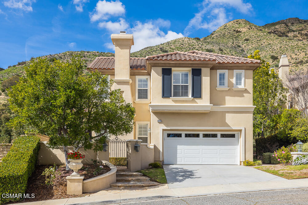 6103 Deerhill Road Oak Park, CA 91377 - Photo 1 of 40 a front view of a house with a yard
