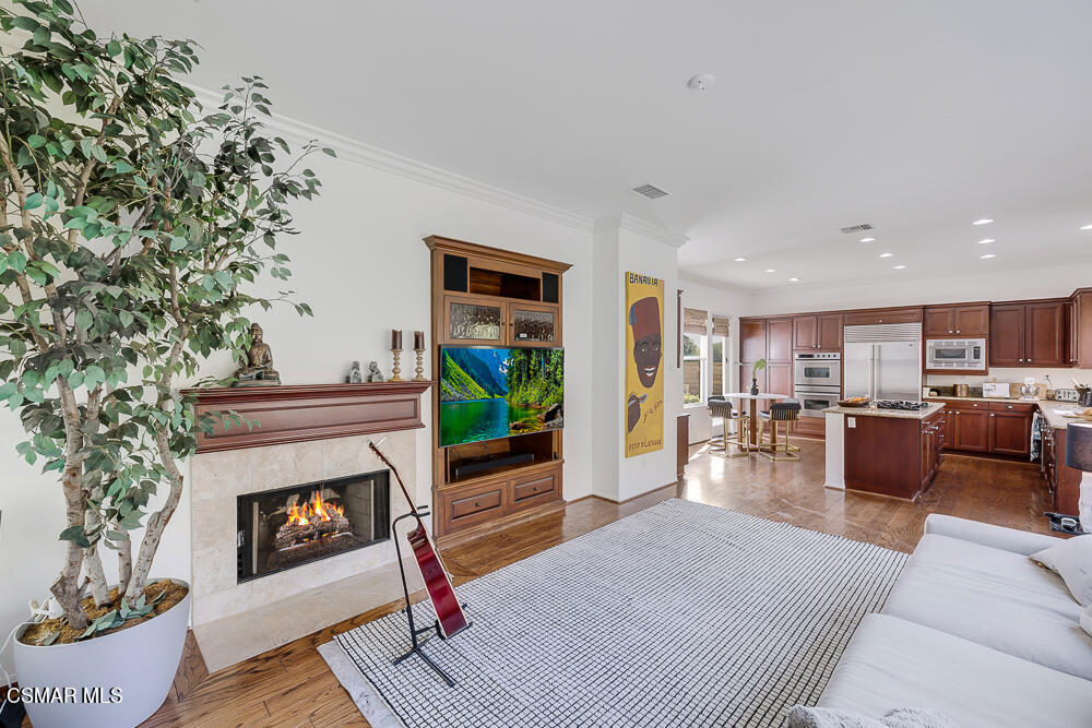 6103 Deerhill Road Oak Park, CA 91377 - Photo 15 of 40 a living room with furniture and a fireplace