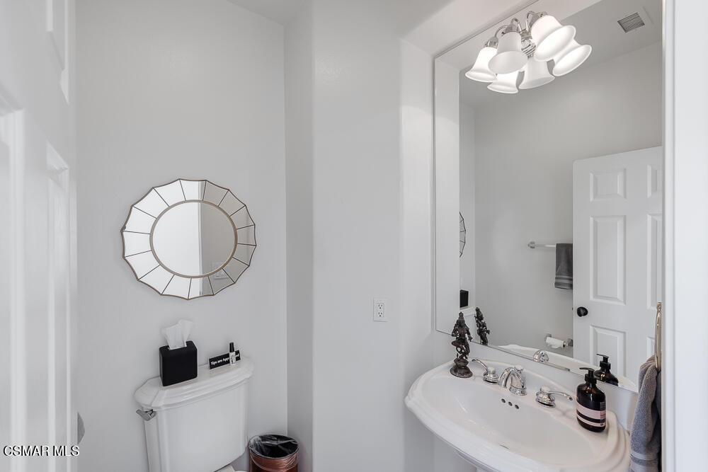 6103 Deerhill Road Oak Park, CA 91377 - Photo 16 of 40 a bathroom with a sink and a mirror