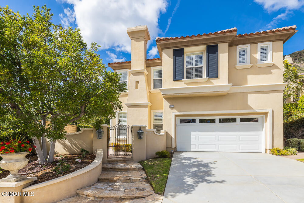 6103 Deerhill Road Oak Park, CA 91377 - Photo 2 of 40 a front view of a house with garden