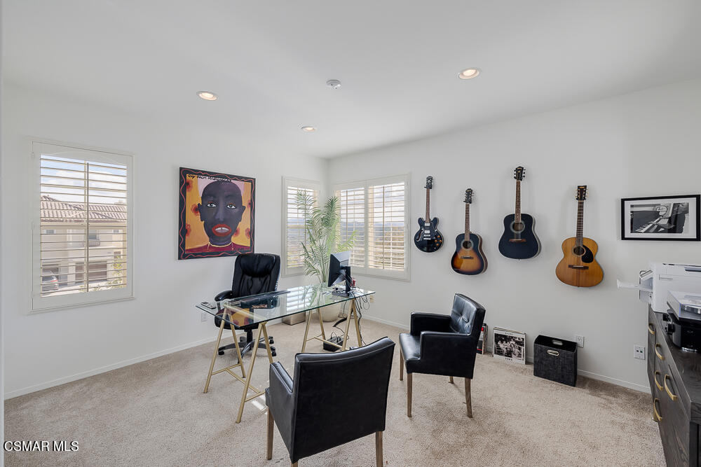 6103 Deerhill Road Oak Park, CA 91377 - Photo 23 of 40 a living room with furniture and a window