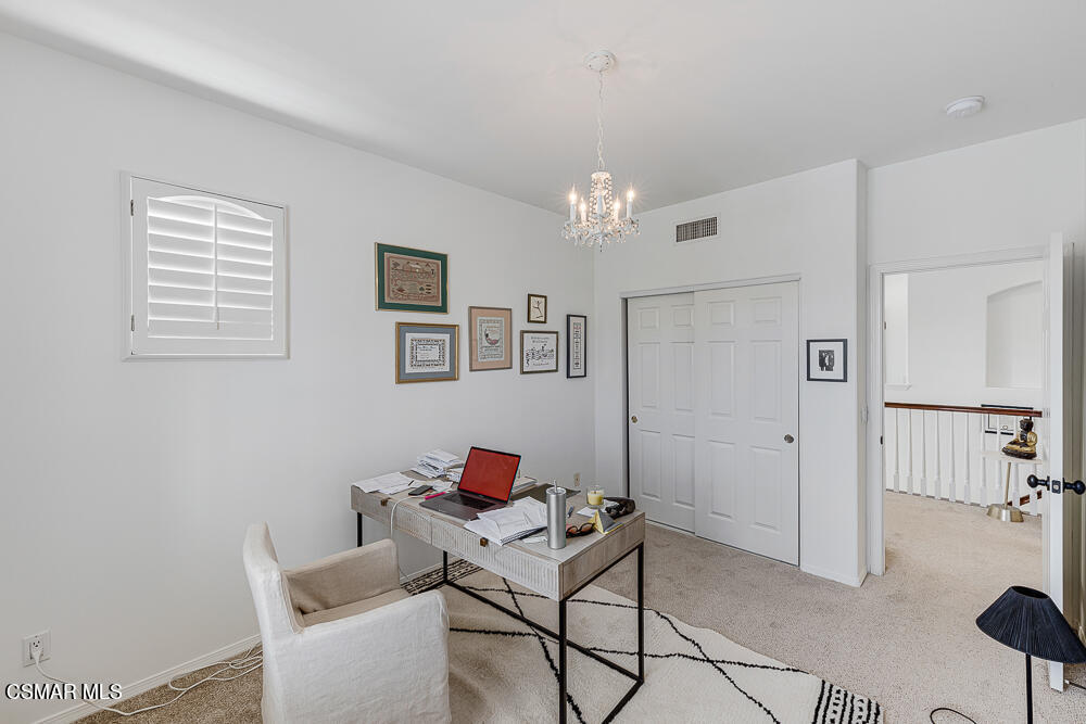 6103 Deerhill Road Oak Park, CA 91377 - Photo 29 of 40 a living room with furniture and a window