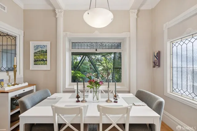 a view of a dining room with furniture window and outside view