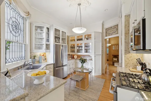 a view of a living room and kitchen