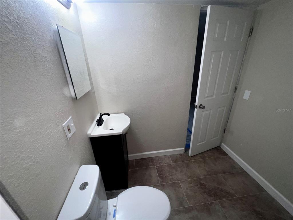 1822 Harding Avenue Sanford, FL 32771 - Photo 15 of 26 a bathroom with a sink and toilet
