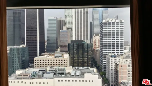 a bathroom with a window and mirror