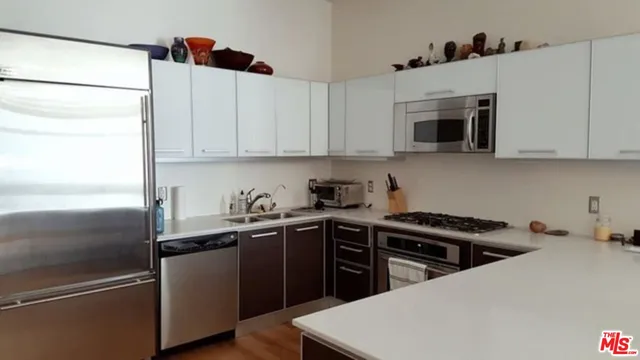 a kitchen with a sink and cabinets