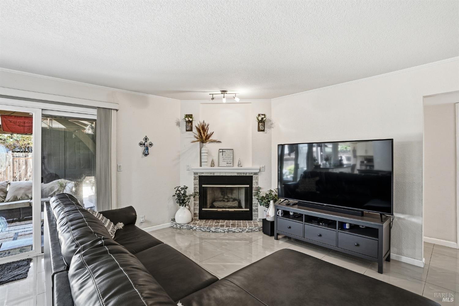 773 Blue Ridge Lane Vacaville, CA 95688 - Photo 12 of 44 a living room with furniture a flat screen tv and a fireplace