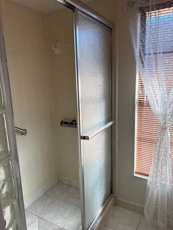21425 Southwest Plantation Street Dunnellon, FL 34431 - Photo 30 of 54 a bathroom with a glass door shower