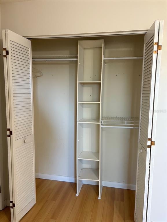 21425 Southwest Plantation Street Dunnellon, FL 34431 - Photo 37 of 54 a view of an empty room with wooden floor and a window