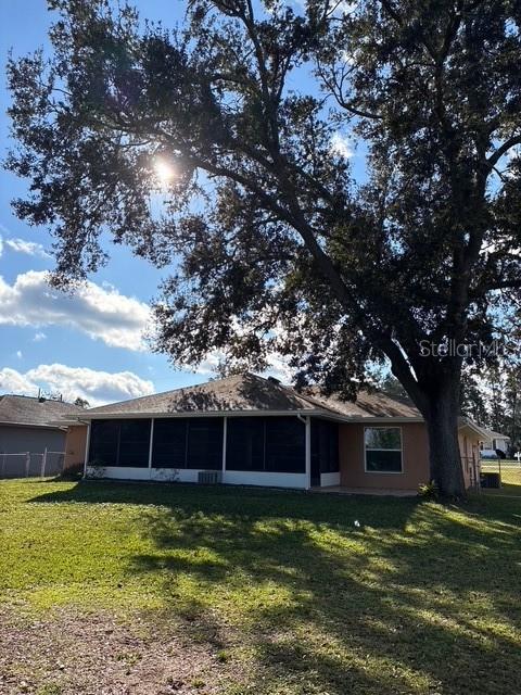 21425 Southwest Plantation Street Dunnellon, FL 34431 - Photo 50 of 54 a front view of a house with garden