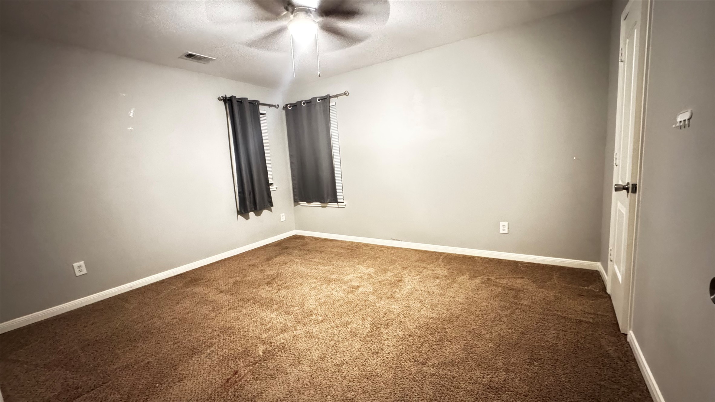 6614 Bluestone Springs Lane Spring, TX 77379 - Photo 17 of 21 an empty room with a ceiling fan and a window