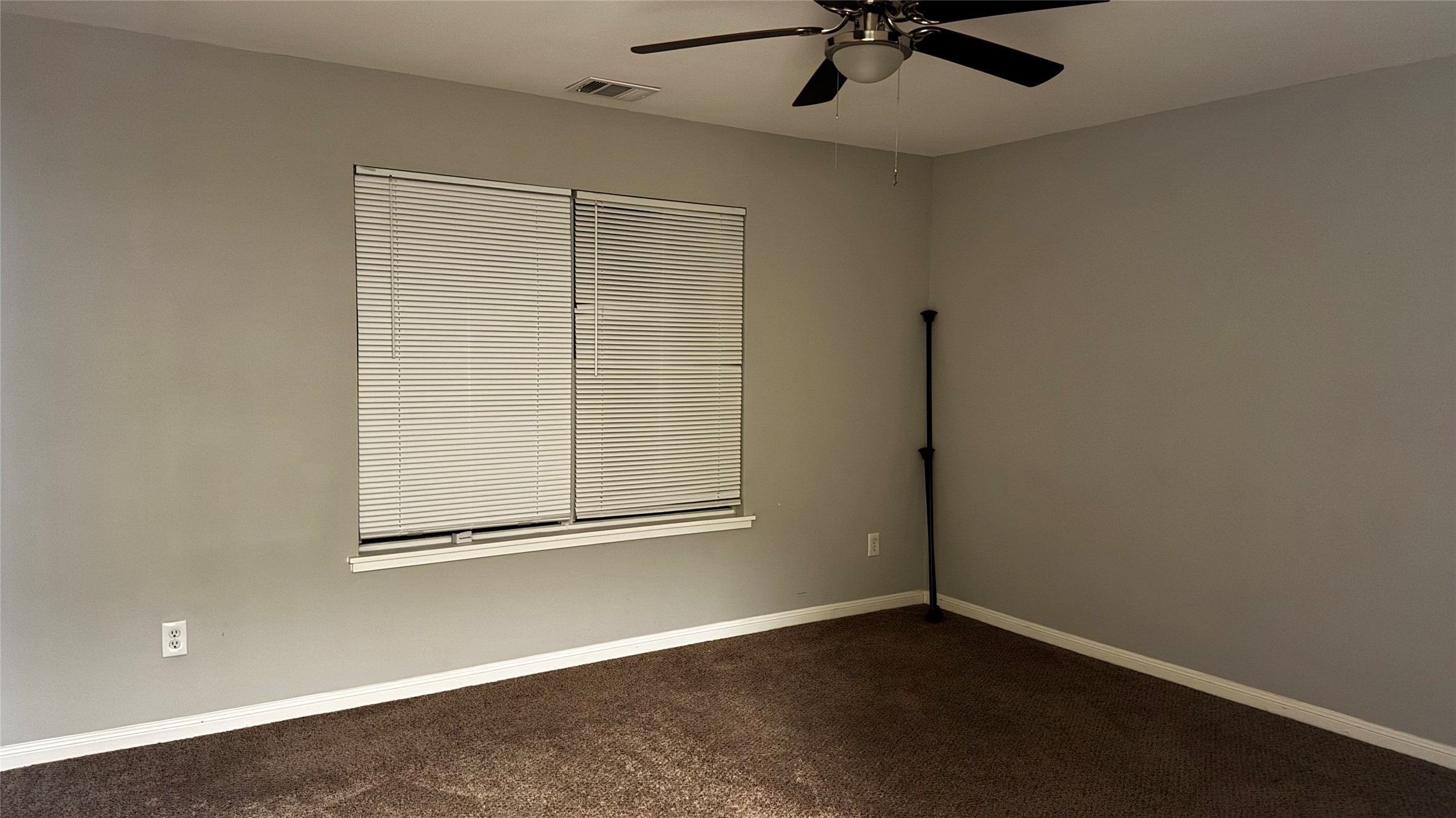 6614 Bluestone Springs Lane Spring, TX 77379 - Photo 21 of 21 an empty room with a window and ceiling fan