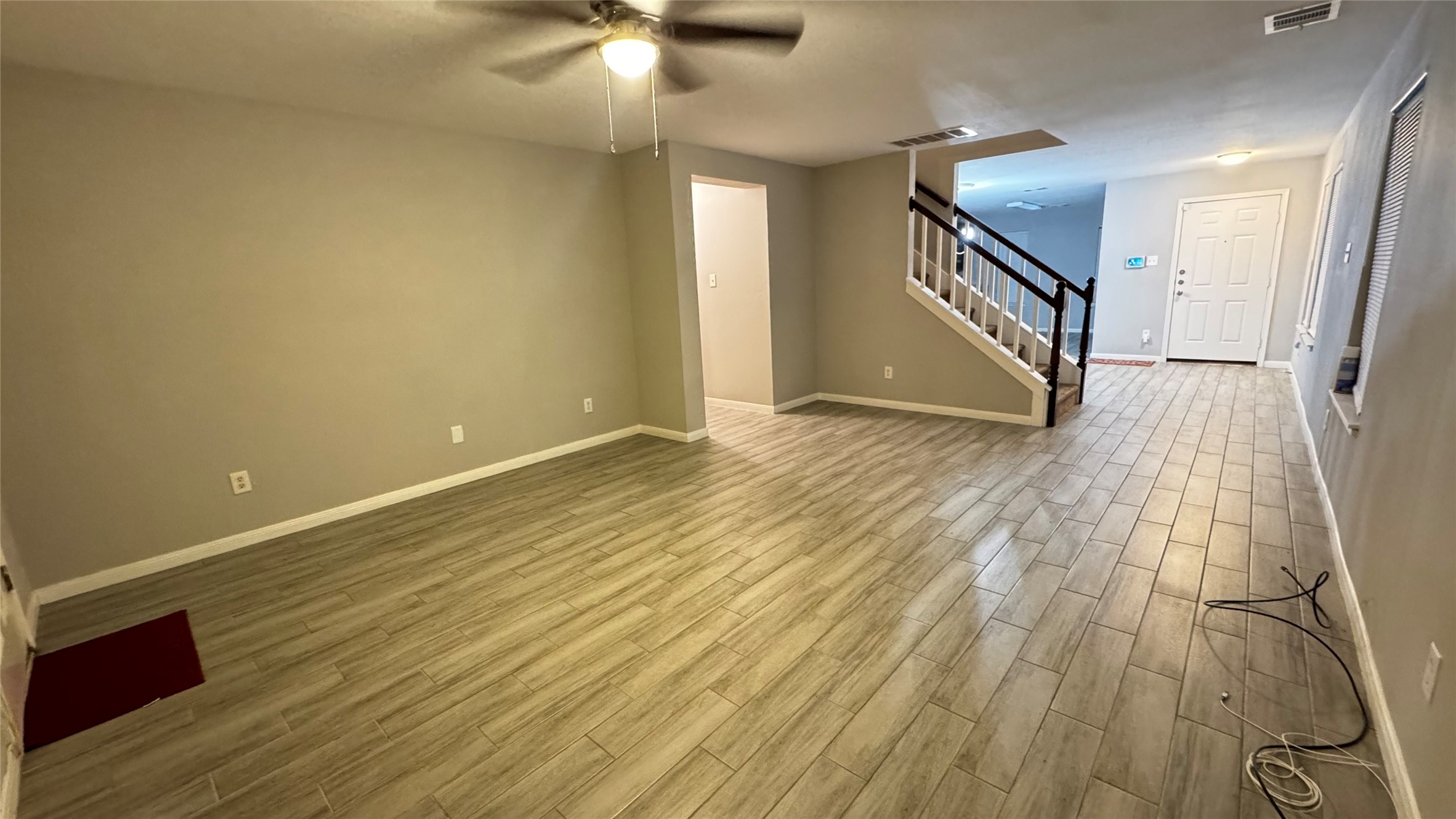 6614 Bluestone Springs Lane Spring, TX 77379 - Photo 4 of 21 wooden floor in an empty room with a window