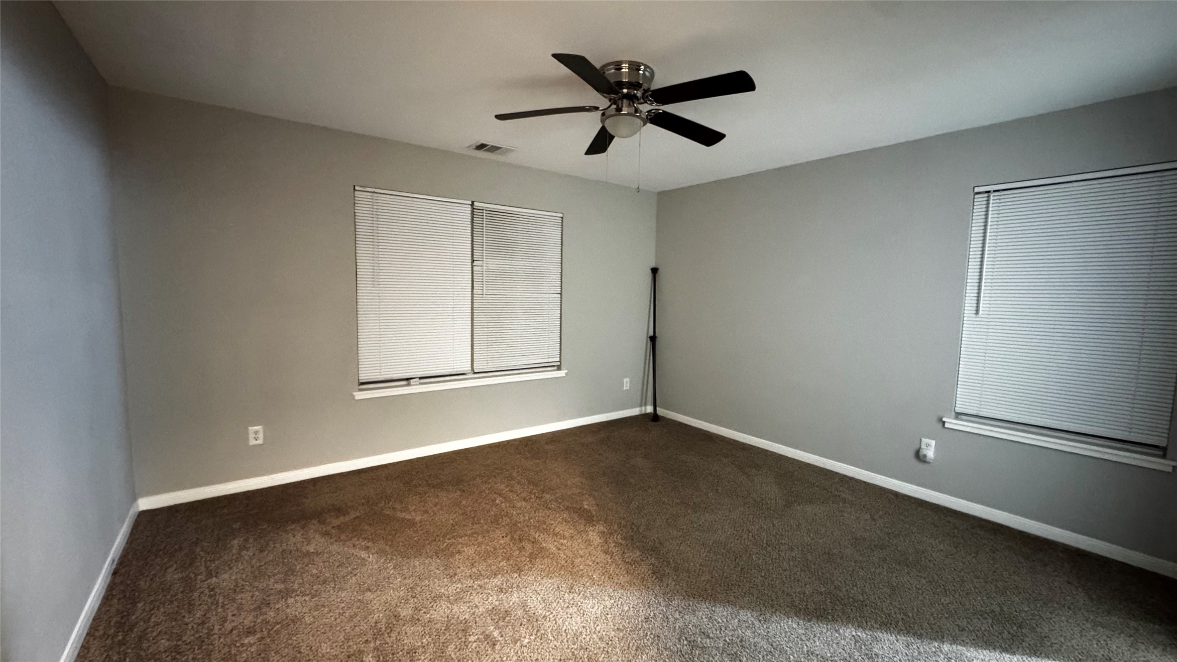 6614 Bluestone Springs Lane Spring, TX 77379 - Photo 10 of 21 an empty room with a window and a ceiling fan