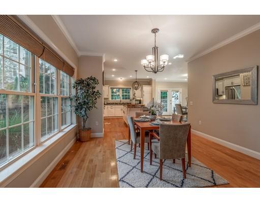 2 Farmer Road Arlington, MA 02476 - Photo 8 of 26 a view of a dining room with furniture window and wooden floor