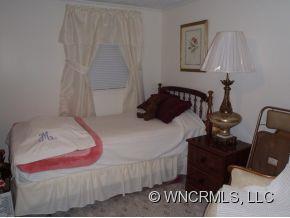 295 Roper Loop Road Rutherfordton, NC 28139 - Photo 12 of 12 a bedroom with a bed and a window