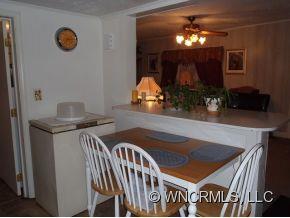 295 Roper Loop Road Rutherfordton, NC 28139 - Photo 7 of 12 a view of a livingroom with furniture and chandelier