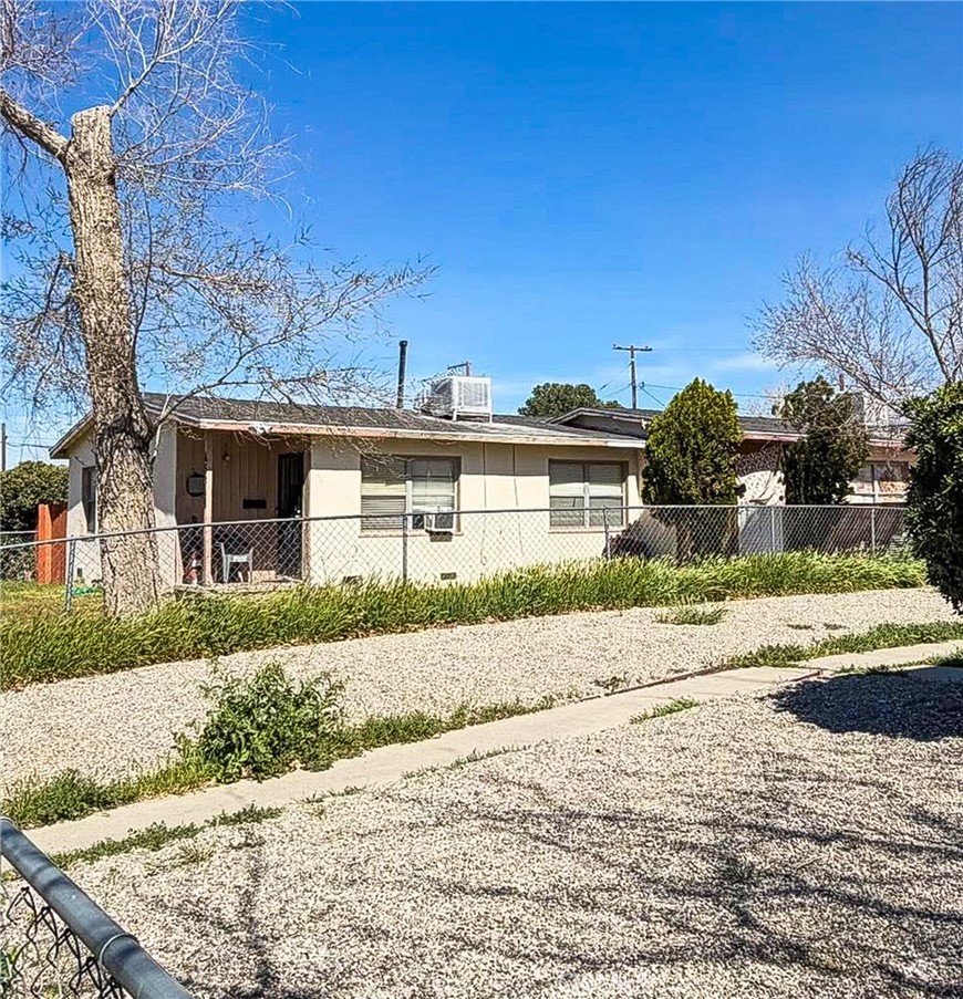 45348 10th Street West Lancaster, CA 93534 - Photo 1 of 2 front view of a house with a yard