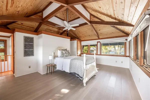 a view of a balcony with wooden floor