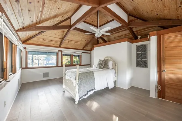 a view of a house with a patio and wooden deck