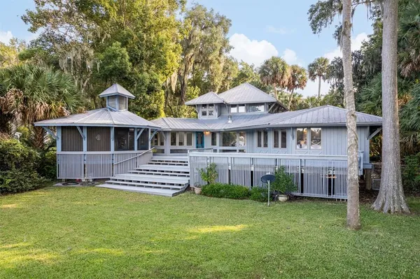 a view of a hallway with wooden floor and entryway