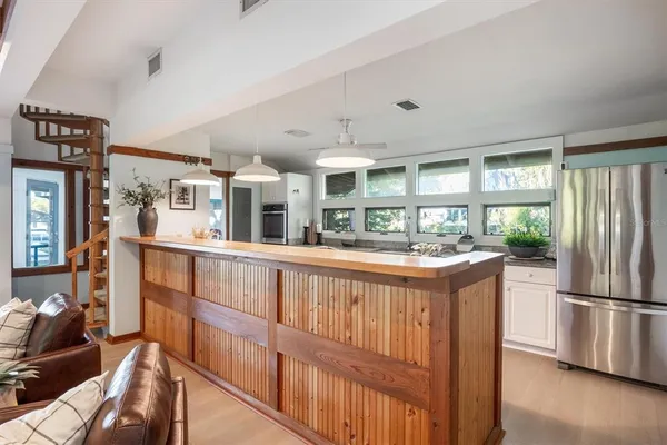 a view of a dining room with furniture window and outside view