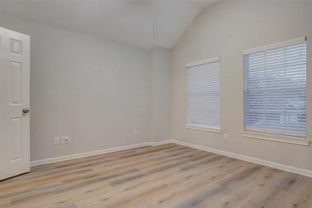 wooden floor and window in an empty room