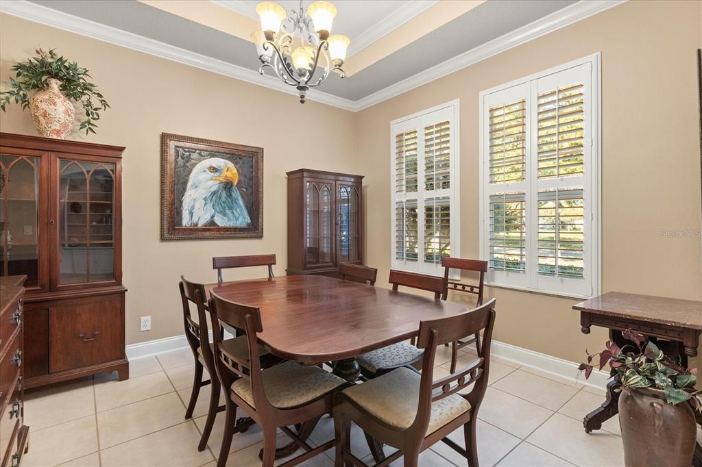 504 Garden Club Drive Deland, FL 32724 - Photo 14 of 35 a view of a dining room with furniture window and outside view