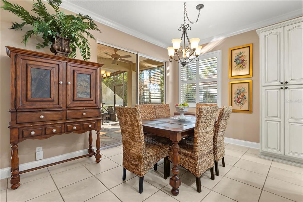 504 Garden Club Drive Deland, FL 32724 - Photo 8 of 35 a view of a dining room with furniture and window
