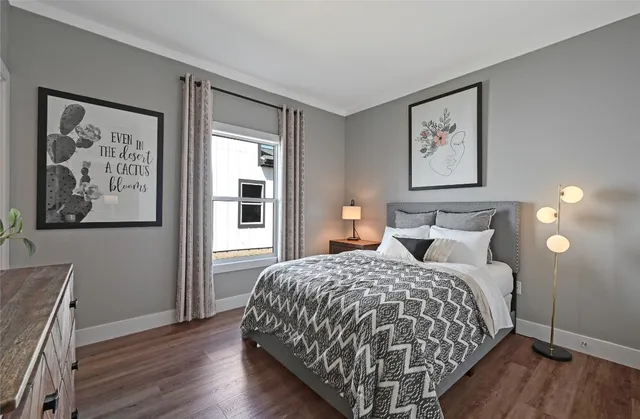 a bedroom with a large bed and a window