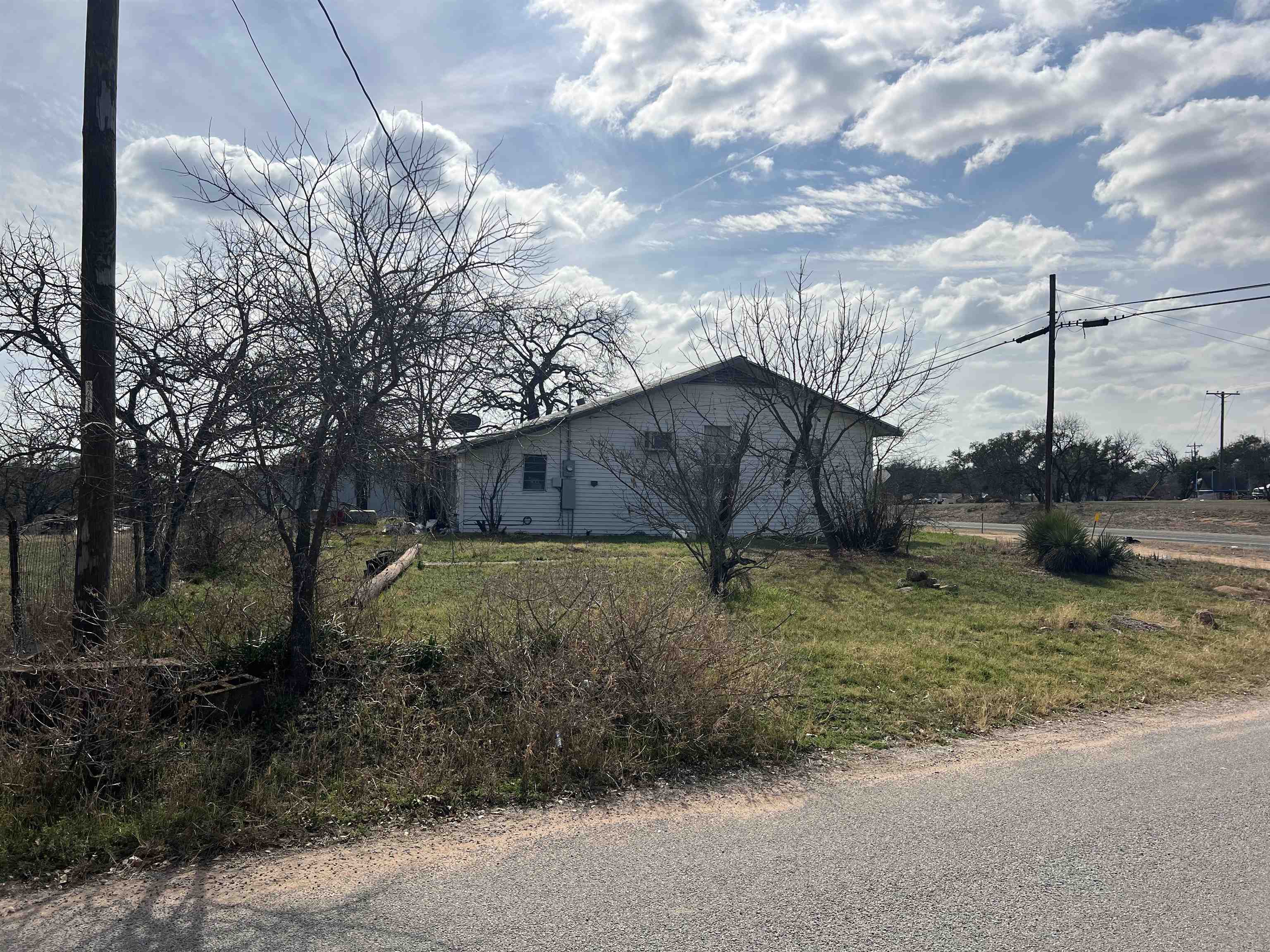 1034 Ranch Road 2545 Kingsland, TX 78639 - Photo 1 of 30 a backyard of a house