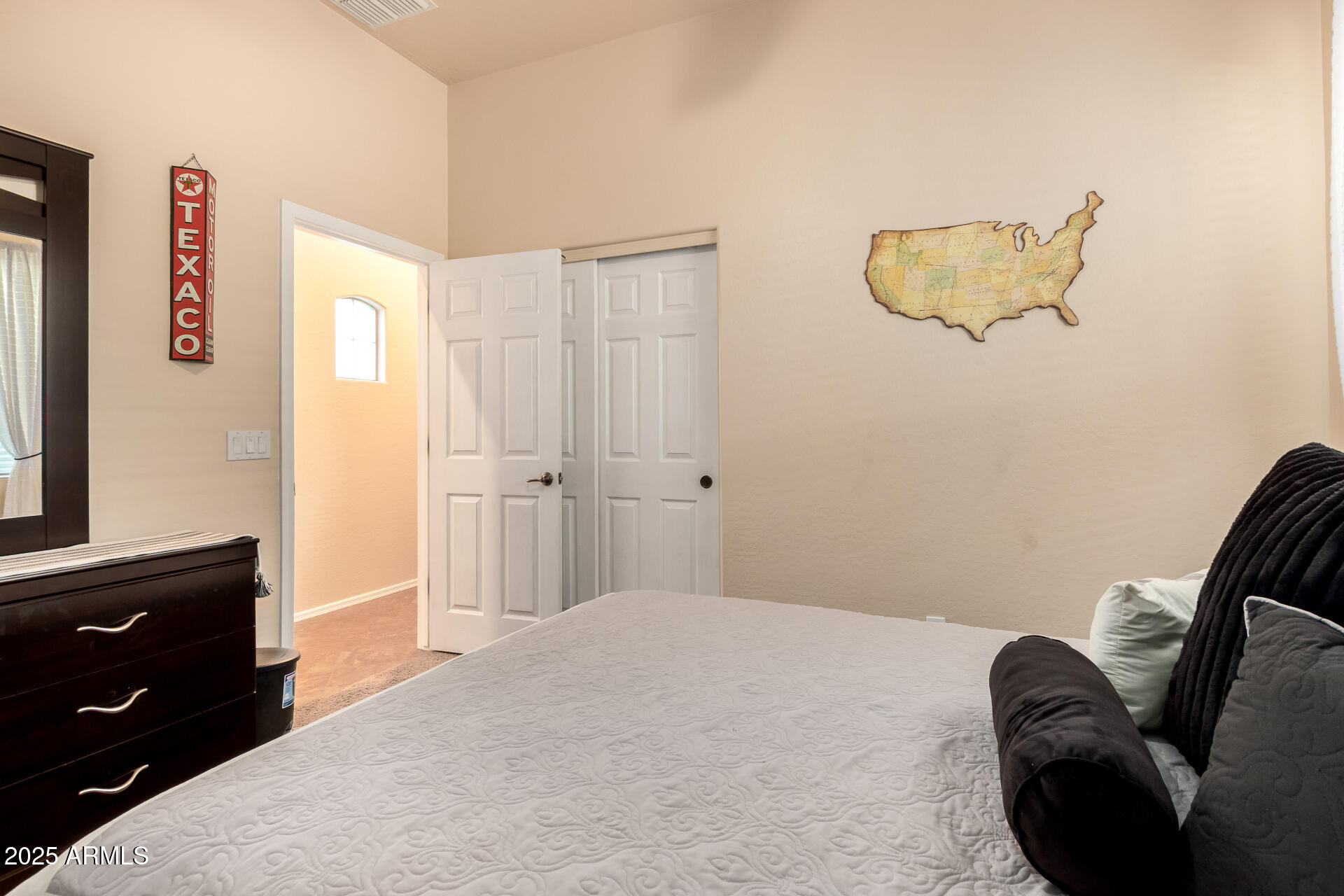 18115 West Desert View Lane Goodyear, AZ 85338 - Photo 24 of 57 a bedroom with a bed and a flat screen tv